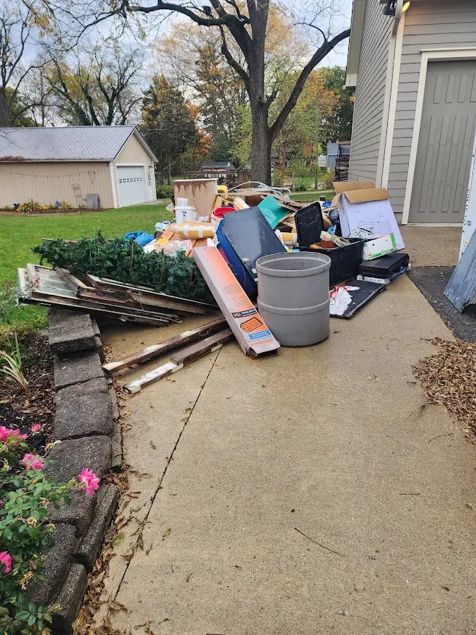 Dumpster being loaded with debris for 30 Yard Dumpster Rental in Fern Park